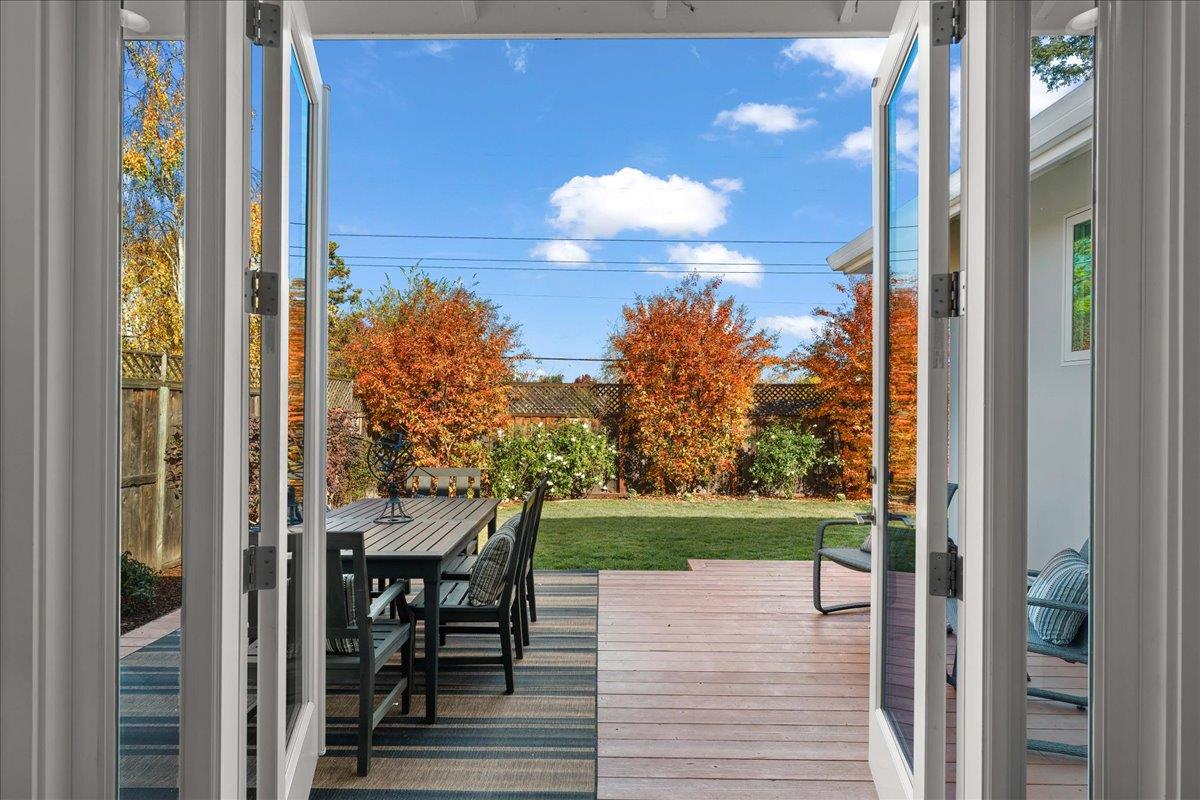 1233 Crompton Road Redwood City, CA 94061 - Photo 23 of 28 a view of a porch with a dining table and chairs