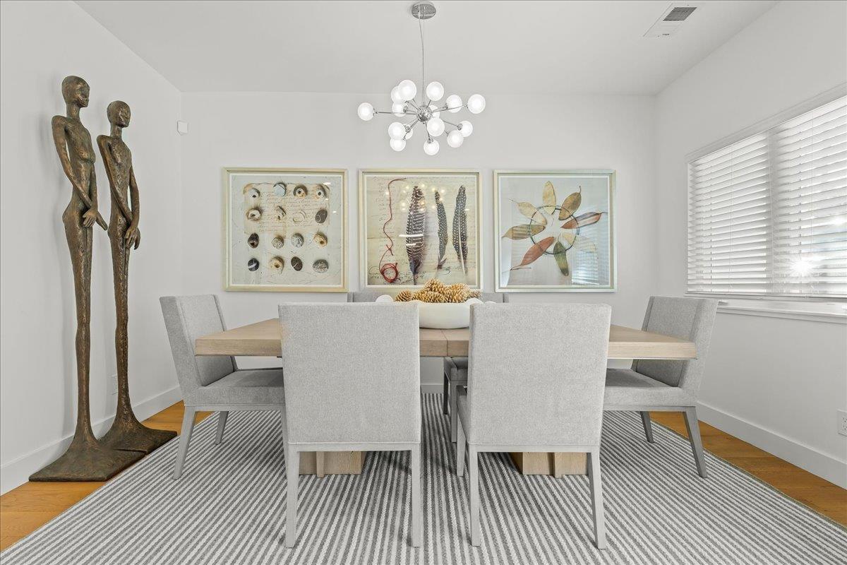 1233 Crompton Road Redwood City, CA 94061 - Photo 6 of 28 a dining room with wooden floor and a chandelier