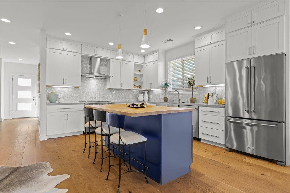 1233 Crompton Road Redwood City, CA 94061 - Photo 8 of 28 a kitchen with kitchen island granite countertop wooden cabinets and stainless steel appliances