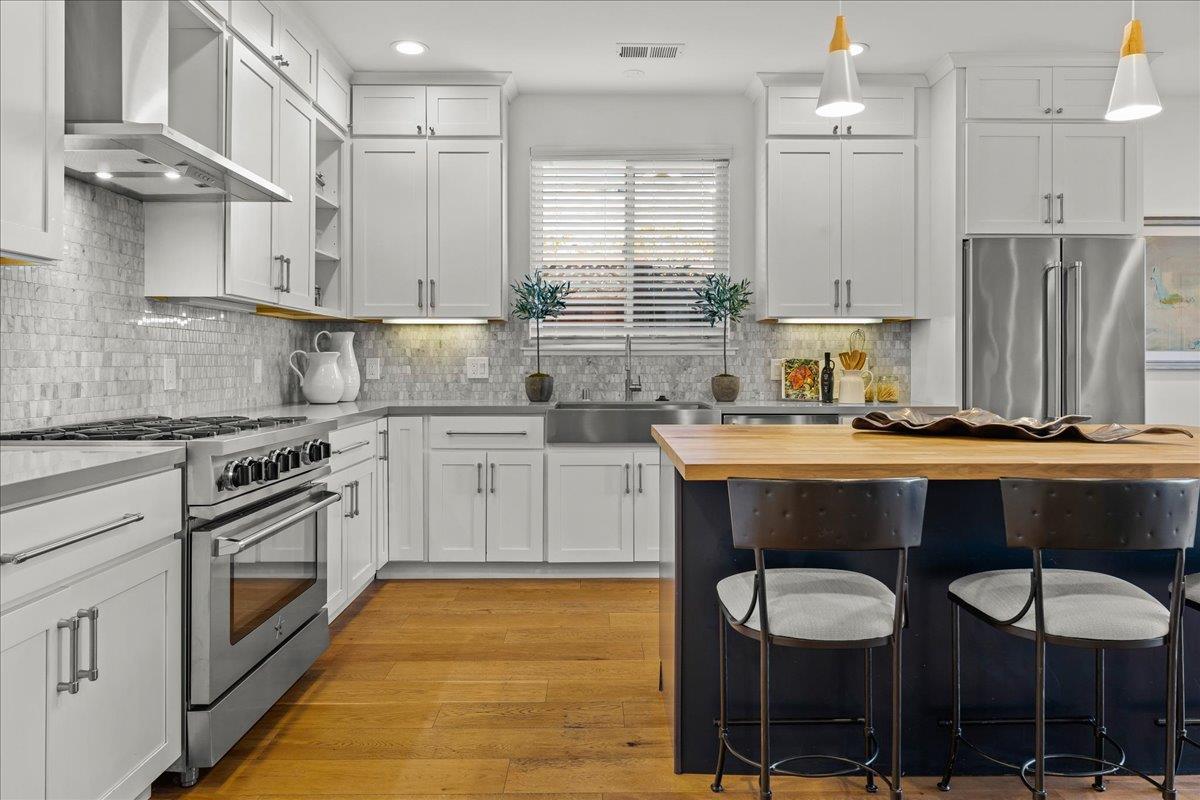 1233 Crompton Road Redwood City, CA 94061 - Photo 9 of 28 a kitchen with a sink cabinets and stainless steel appliances