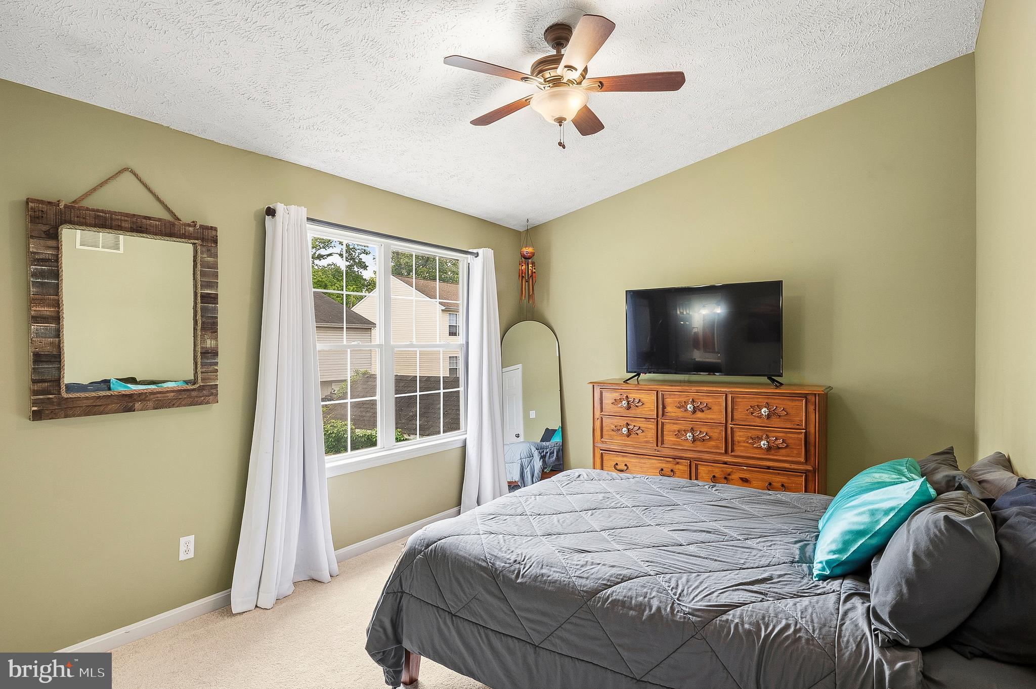 757 209th Street Pasadena, MD 21122 - Photo 11 of 32 a bedroom with a bed and a flat screen tv