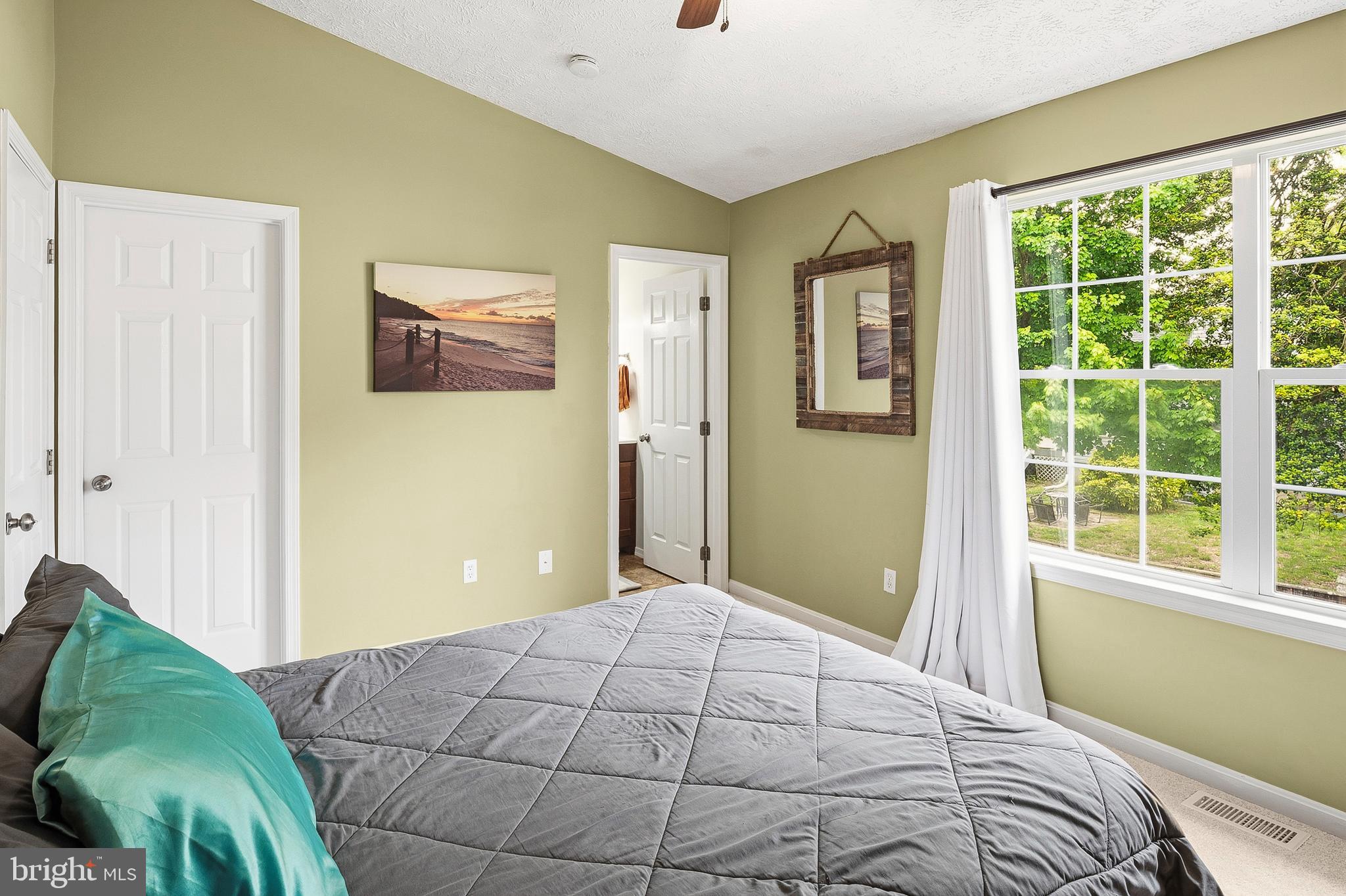 757 209th Street Pasadena, MD 21122 - Photo 13 of 32 a bedroom with a bed and a window
