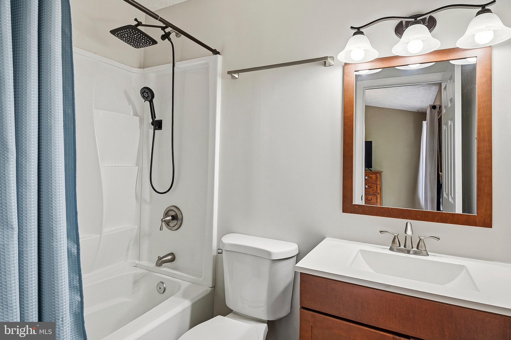 757 209th Street Pasadena, MD 21122 - Photo 14 of 32 a bathroom with a sink toilet and shower