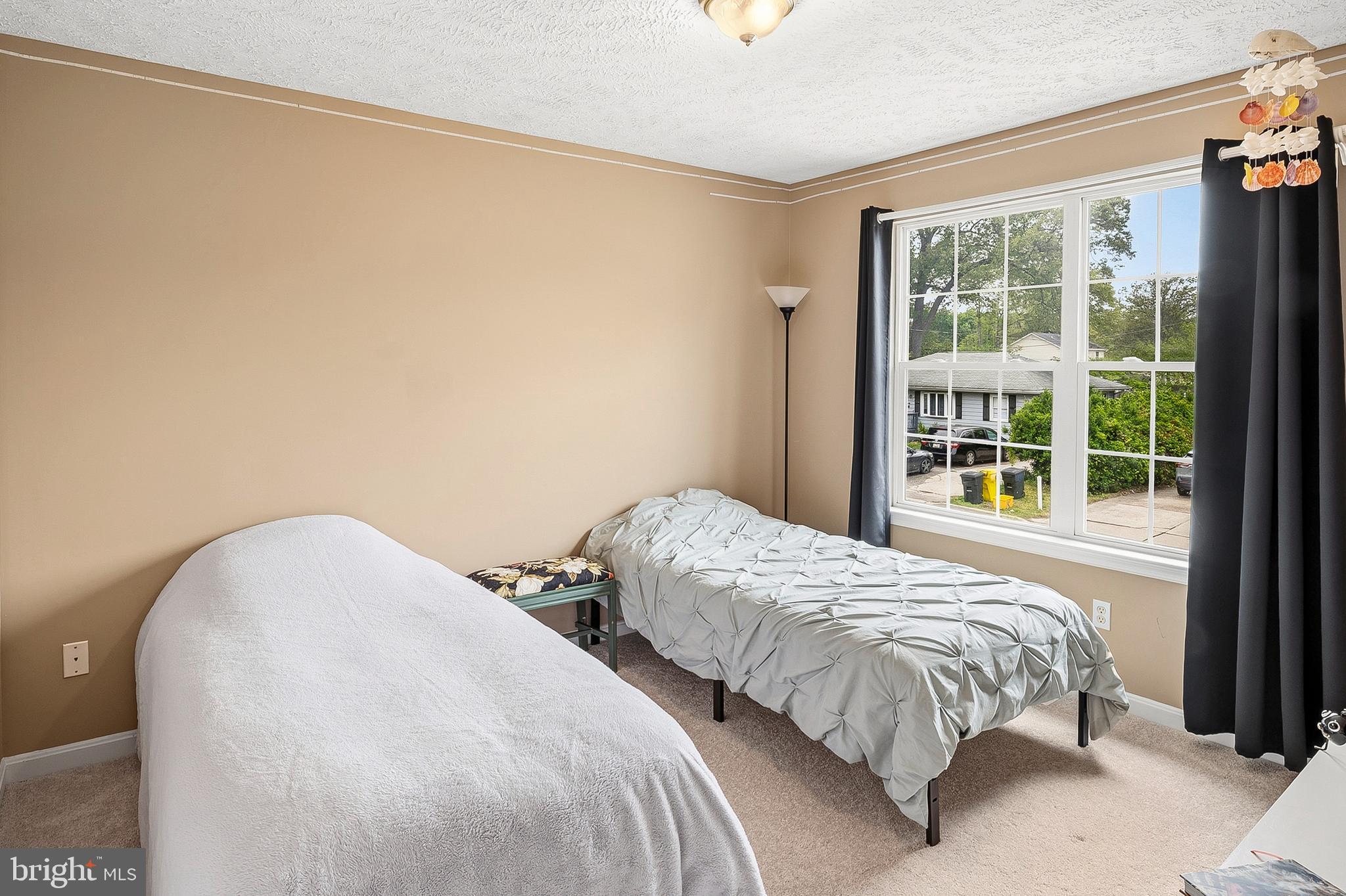 757 209th Street Pasadena, MD 21122 - Photo 15 of 32 a bedroom with two beds and a window