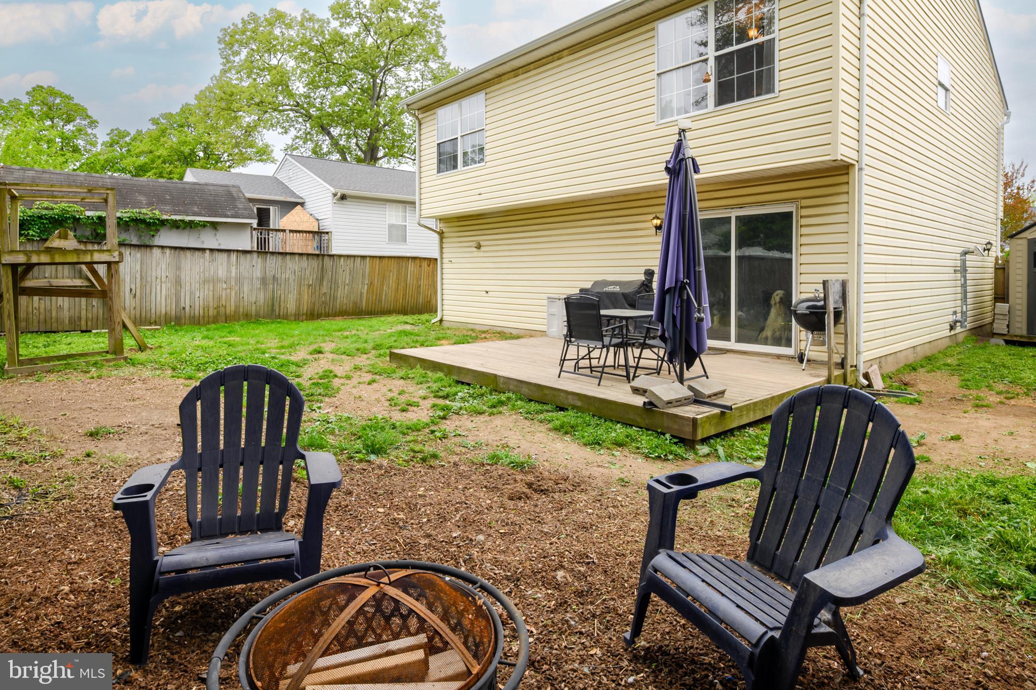 757 209th Street Pasadena, MD 21122 - Photo 21 of 32 a view of backyard with deck and outdoor seating