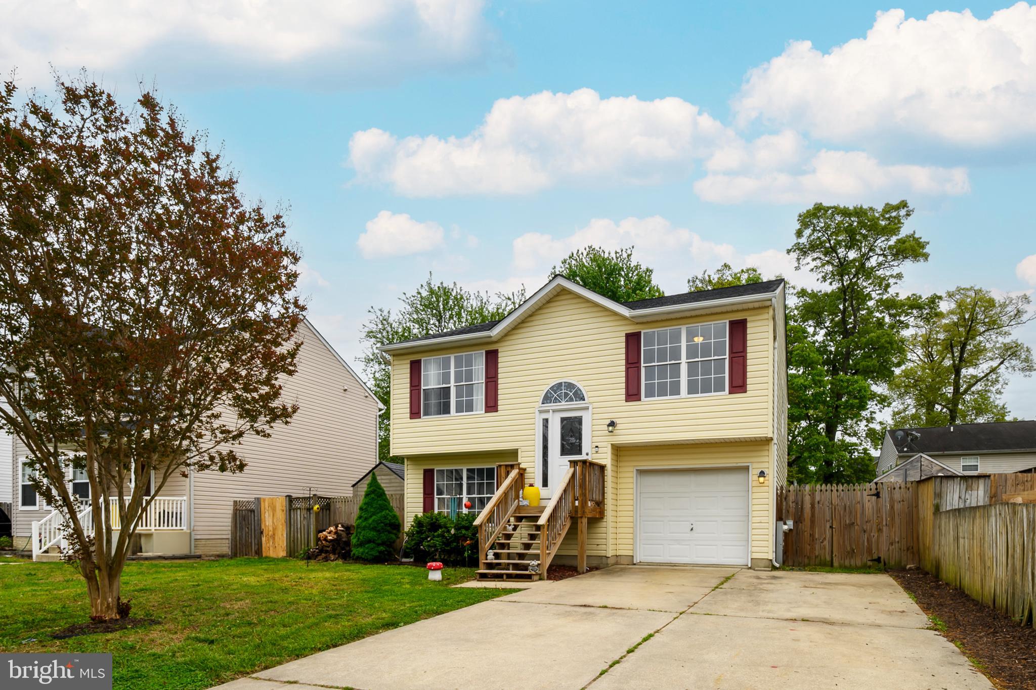757 209th Street Pasadena, MD 21122 - Photo 3 of 32 a front view of a house with a garden