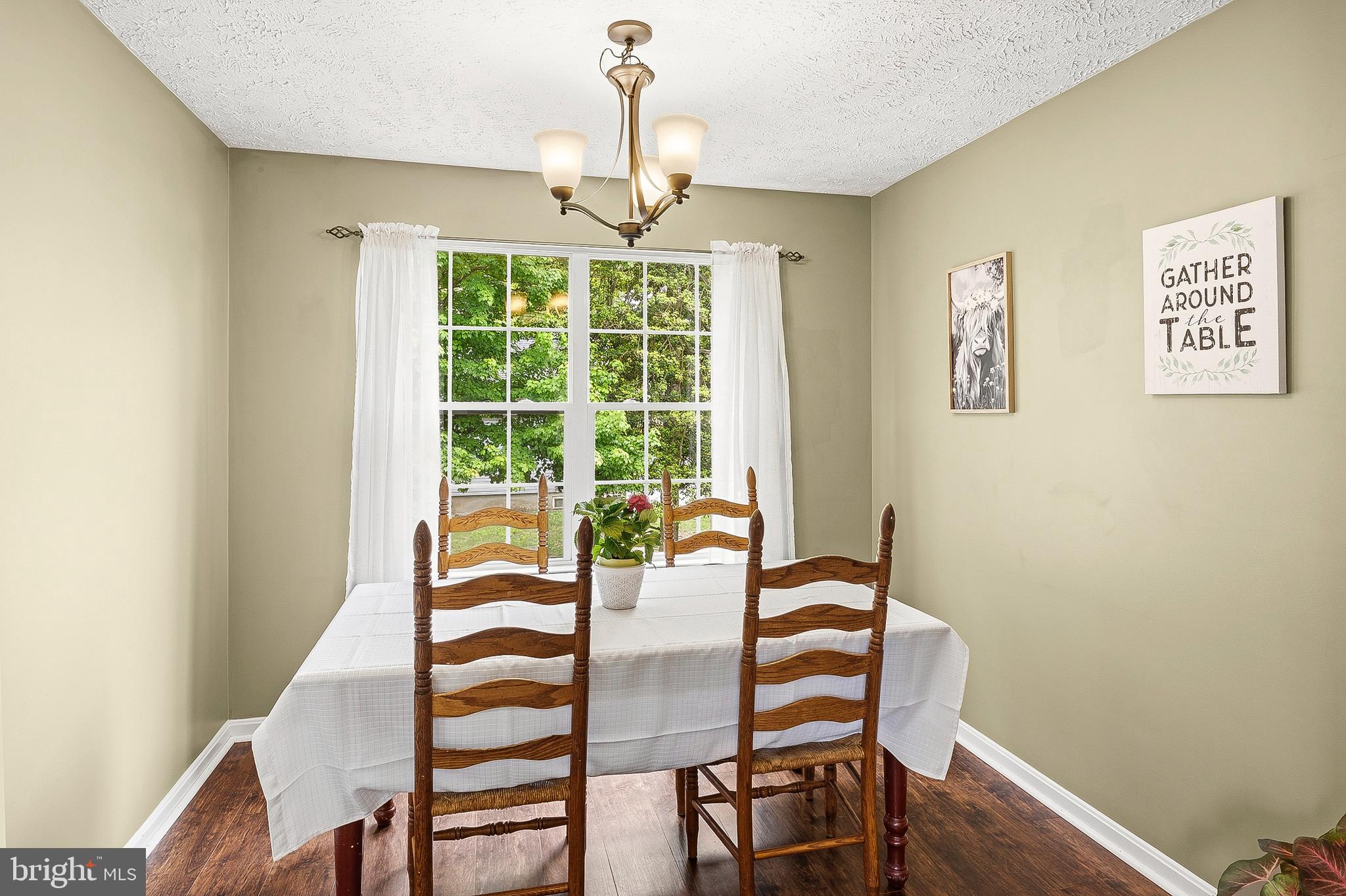 757 209th Street Pasadena, MD 21122 - Photo 7 of 32 a dining room with furniture window and wooden floor