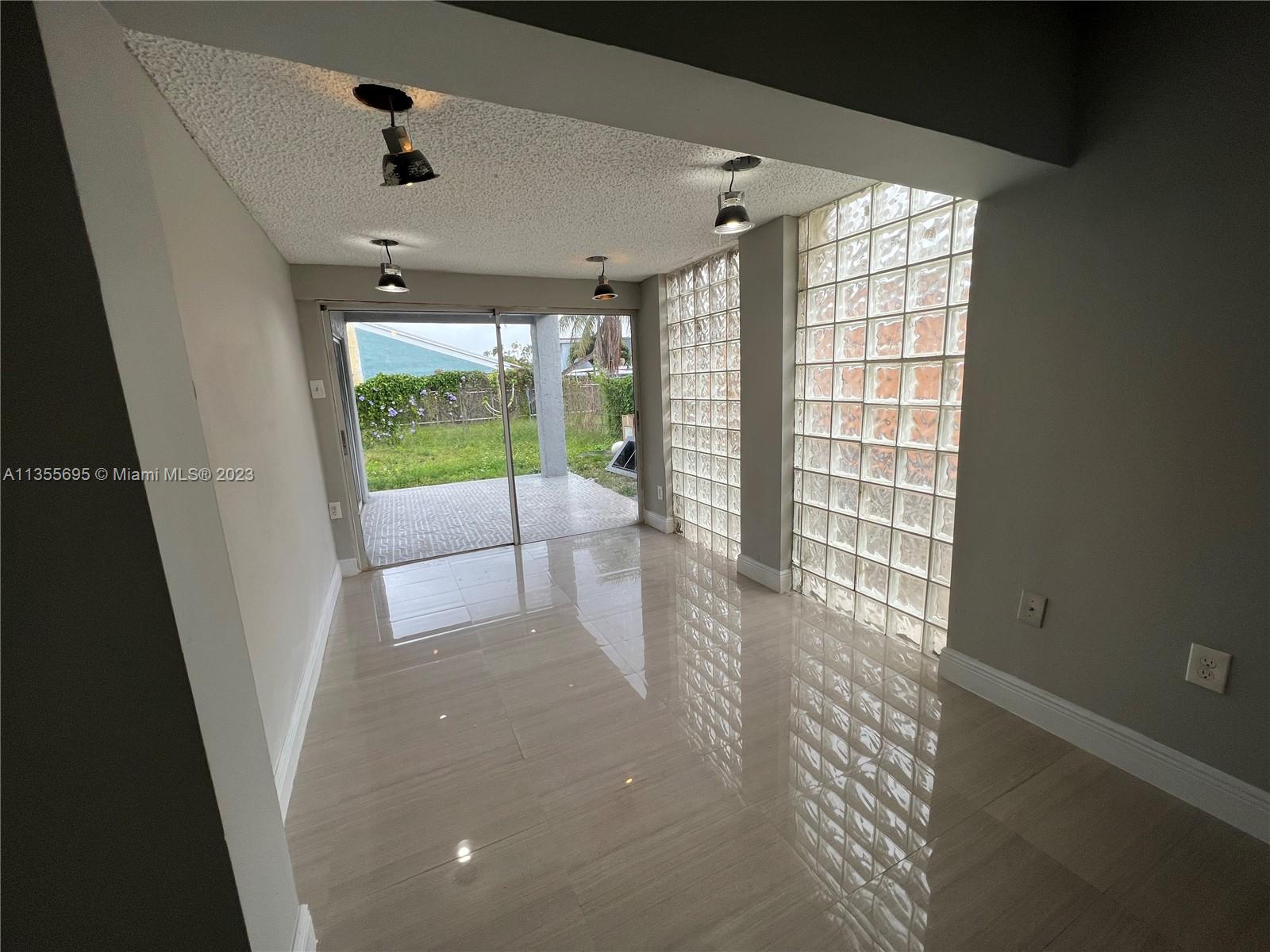 14661 Southwest 99th Street Miami, FL 33186 - Photo 12 of 14 a view of an empty room with a window