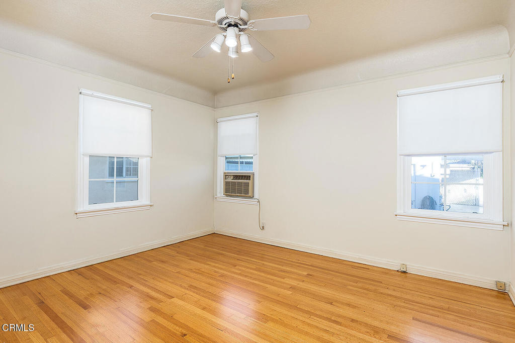 1012 South 2nd Street Alhambra, CA 91801 - Photo 15 of 25 a view of an empty room with wooden floor and a window