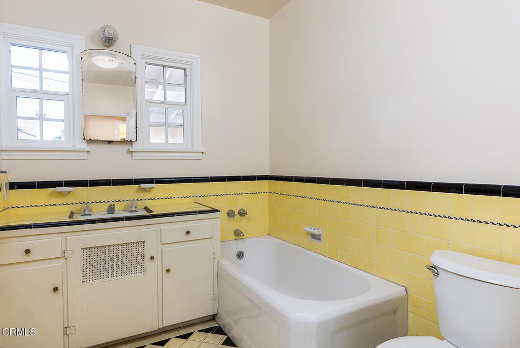 1012 South 2nd Street Alhambra, CA 91801 - Photo 16 of 25 a bathroom with a tub sink and mirror