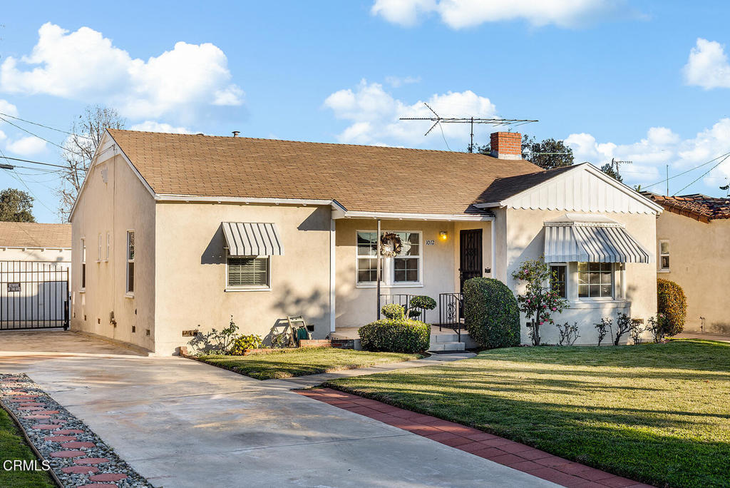 1012 South 2nd Street Alhambra, CA 91801 - Photo 2 of 25 a front view of a house with a yard