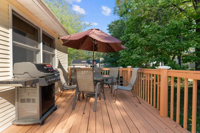 a view of balcony with outdoor seating and wooden floor