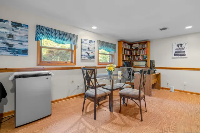 a dining room with furniture and window