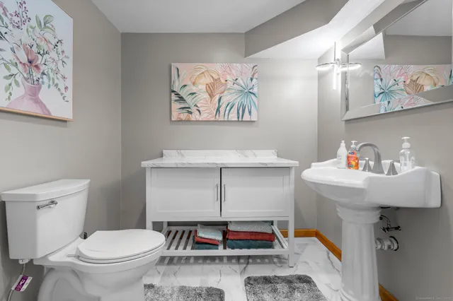 a bathroom with a toilet and a sink