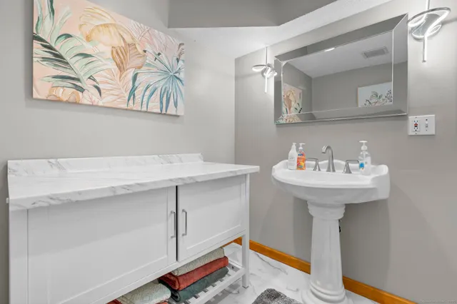 a bathroom with a sink and a mirror