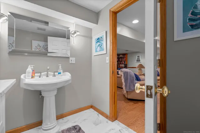a bathroom with a sink and a mirror