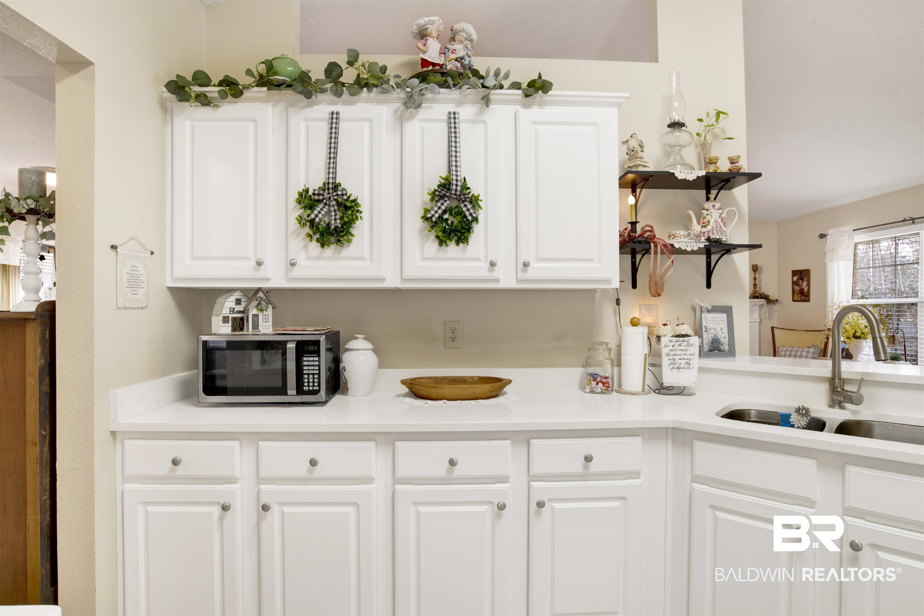 11697 Balsam Court Daphne, AL 36527 - Photo 14 of 31 Kitchen with white cabinetry and sink