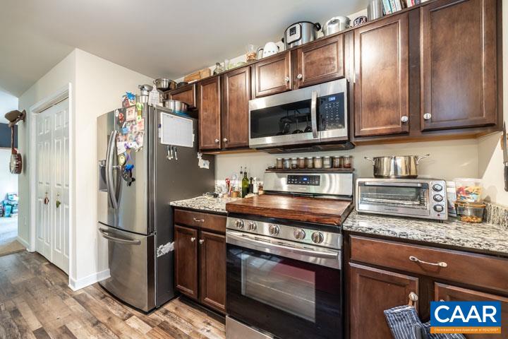 46 Brougham Road Palmyra, VA 22963 - Photo 16 of 27 a kitchen with stainless steel appliances granite countertop a stove a refrigerator and a microwave