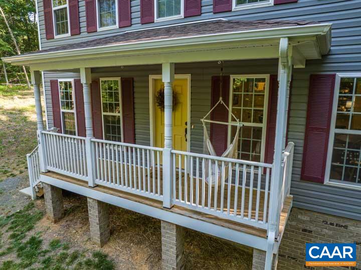 46 Brougham Road Palmyra, VA 22963 - Photo 2 of 27 a porch with a bench