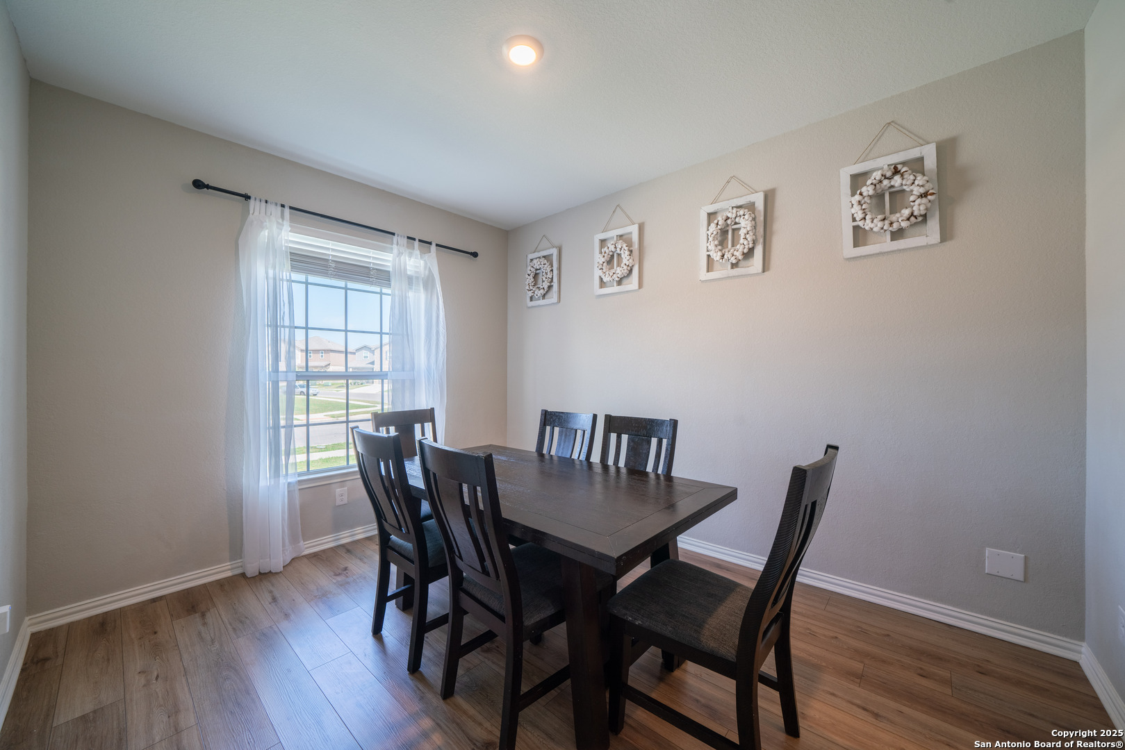 6430 Thorpe Converse, TX 78109 - Photo 13 of 25 a view of a dining room with furniture window and wooden floor