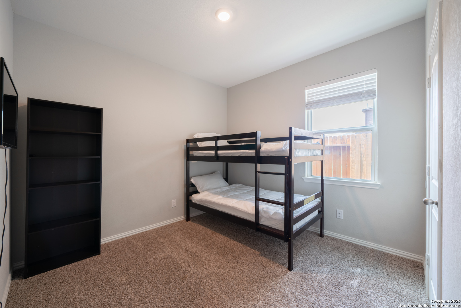6430 Thorpe Converse, TX 78109 - Photo 19 of 25 a bedroom with a bed and a window