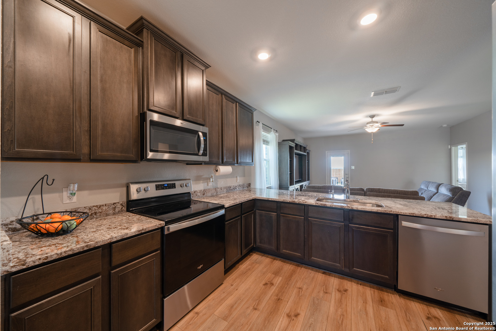 6430 Thorpe Converse, TX 78109 - Photo 10 of 25 a kitchen with granite countertop stainless steel appliances and sink