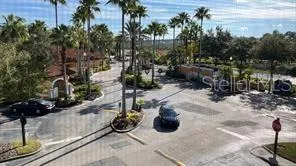 a view of room with window and ceiling fan