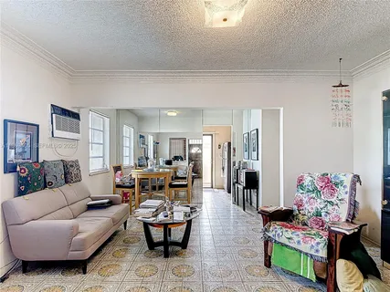a living room with furniture and a table