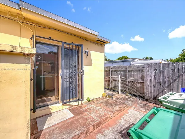 a view of a backyard of the house