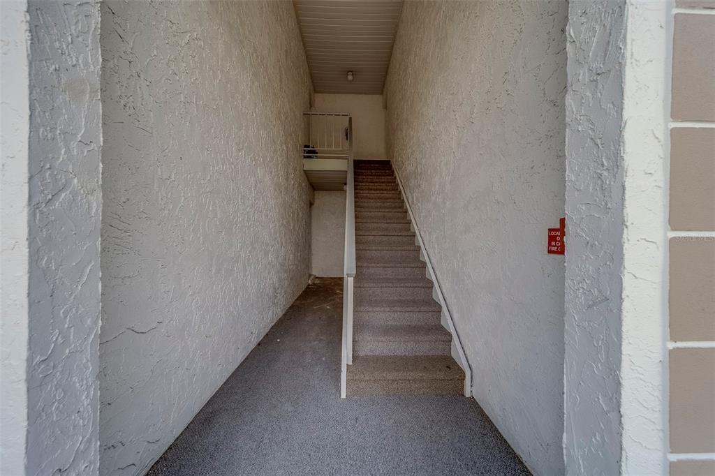 361 South McMullen Booth Road, Unit 112 Clearwater, FL 33759 - Photo 2 of 36 a view of a hallway with wooden floor and entryway