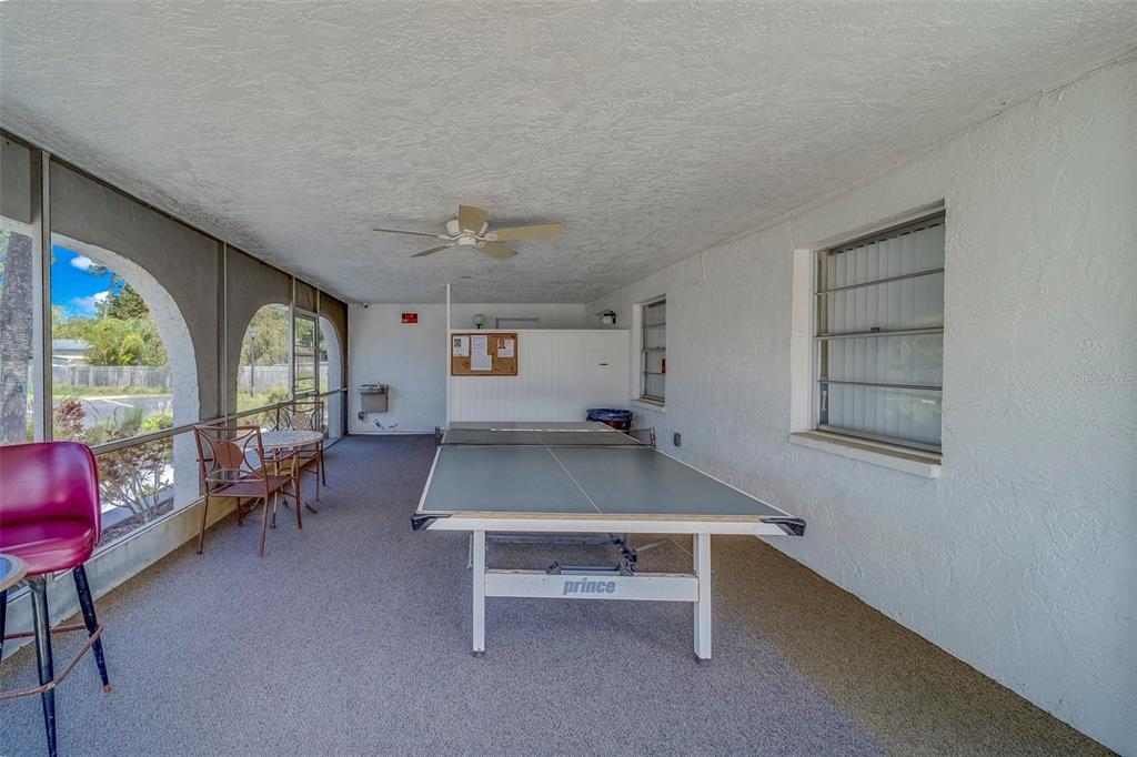 361 South McMullen Booth Road, Unit 112 Clearwater, FL 33759 - Photo 31 of 36 a room with furniture and a large window