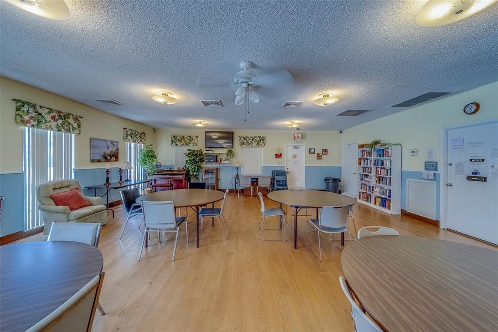 361 South McMullen Booth Road, Unit 112 Clearwater, FL 33759 - Photo 35 of 36 a living room with lots of furniture and kitchen view