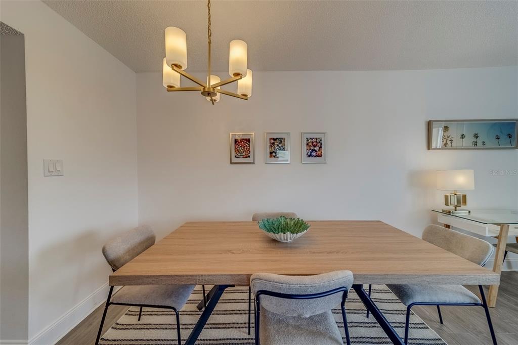 361 South McMullen Booth Road, Unit 112 Clearwater, FL 33759 - Photo 7 of 36 a view of a dining room with furniture