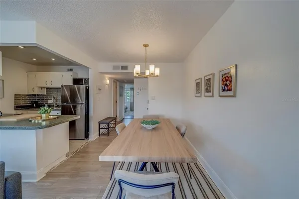 a view of kitchen with cabinets and wooden floor