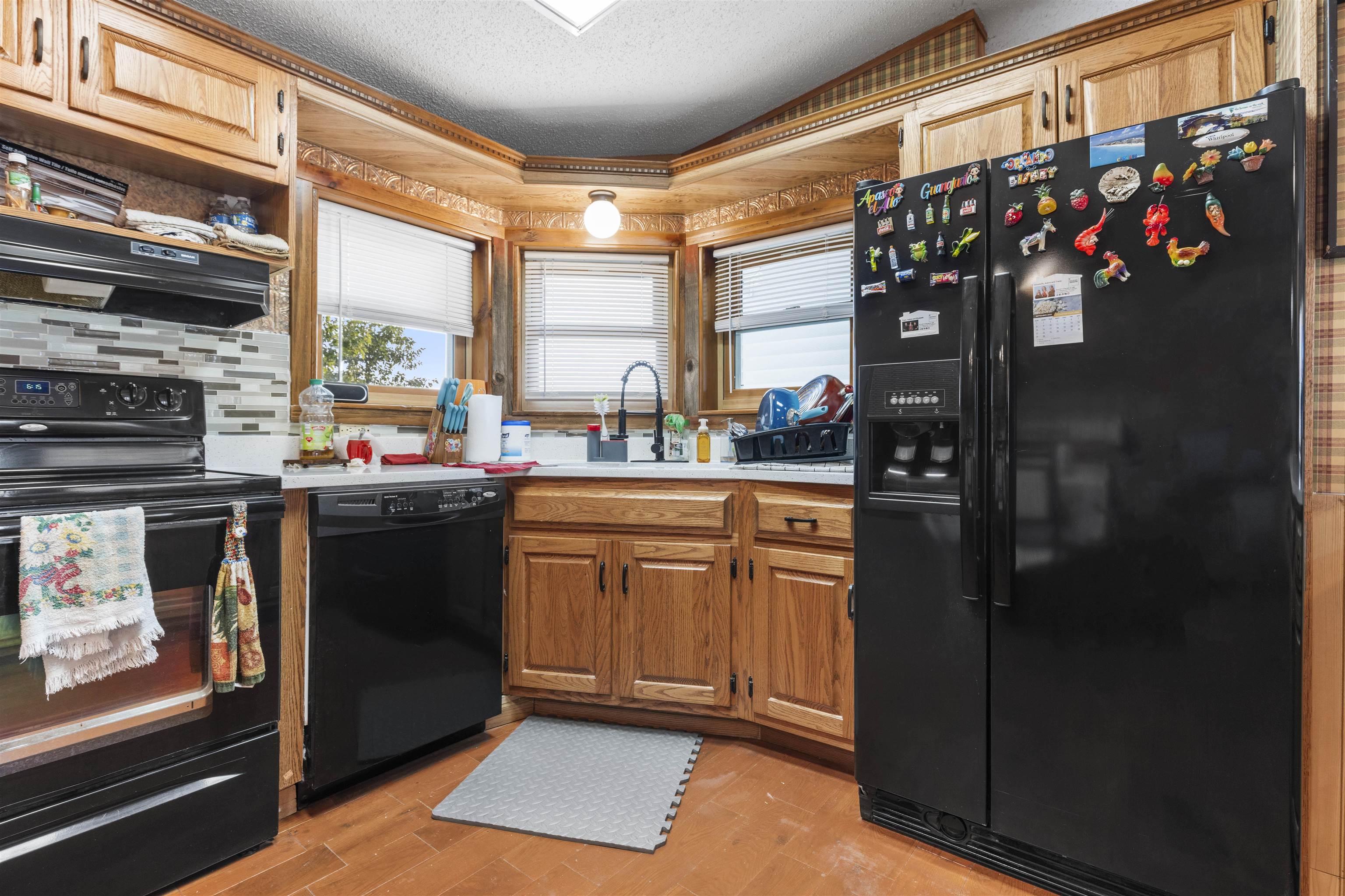 4524 East River Road Ridott, IL 61067 - Photo 7 of 28 a kitchen with stainless steel appliances granite countertop a refrigerator and a sink