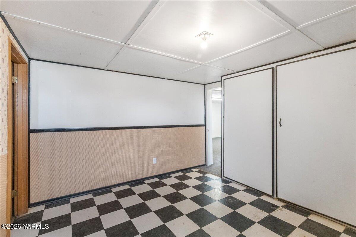 2907 South 3rd Street Union Gap, WA 98903 - Photo 14 of 26 a room with black white checkered floor