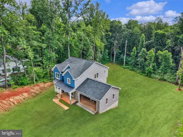 a view of a table and chairs in the garden