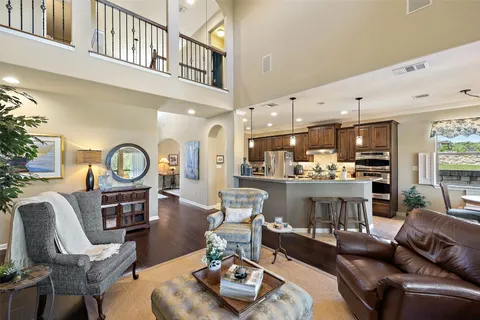 a living room with furniture and a clock