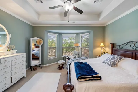 a bedroom with a bed and a dresser