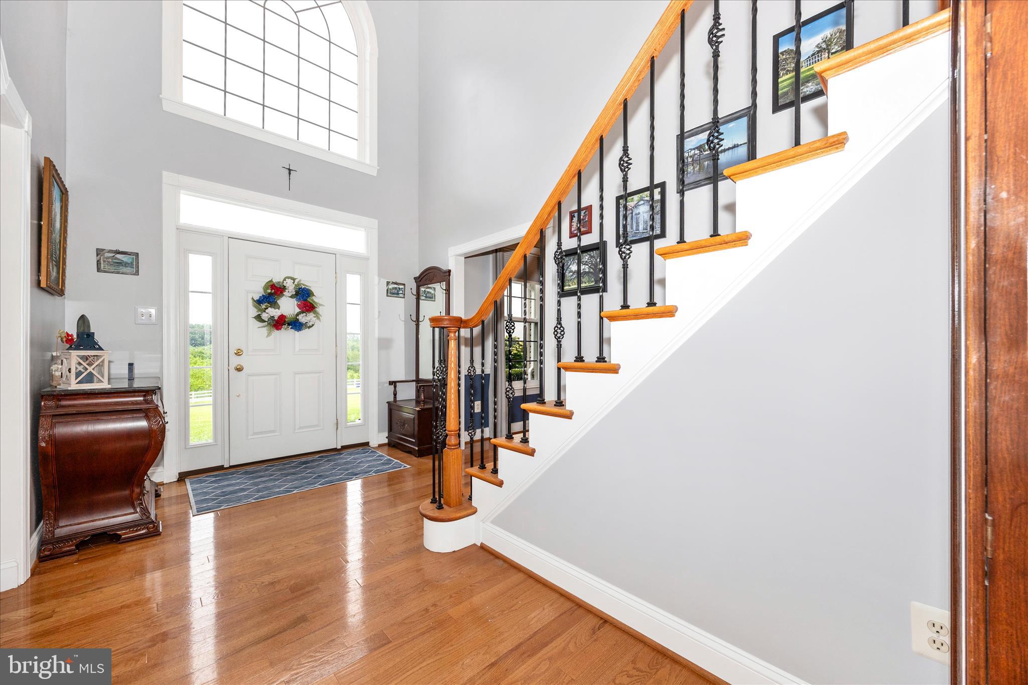 9855 McKinstry Mill Road New Windsor, MD 21776 - Photo 7 of 76 a view of entryway with wooden floor and stairs