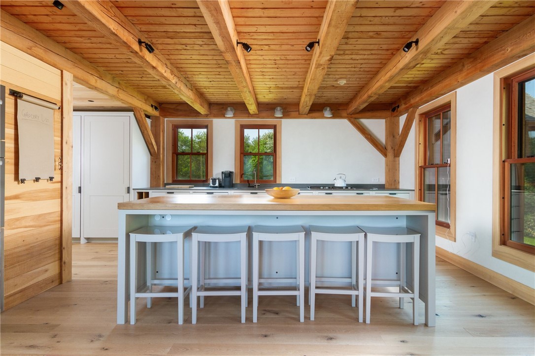 1776 Corn Neck Road Block Island, RI 02807 - Photo 20 of 49 Plain English Kitchen - Lighted Pantry Cabinets - Wolf Gas induction cooktops & ventilation - Miele Oven, Speed Oven & Dishwasher - Subzero Refrigerator & Freezer