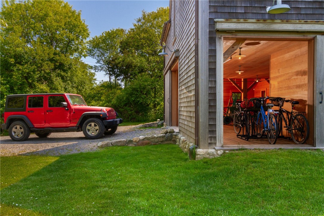 1776 Corn Neck Road Block Island, RI 02807 - Photo 40 of 49 Barn/Garage - Red Cedar Roof & Siding - Marvin Mahogany Wood Windows and Copper Screens- Outdoor Cedar & Ipe Wood Shower