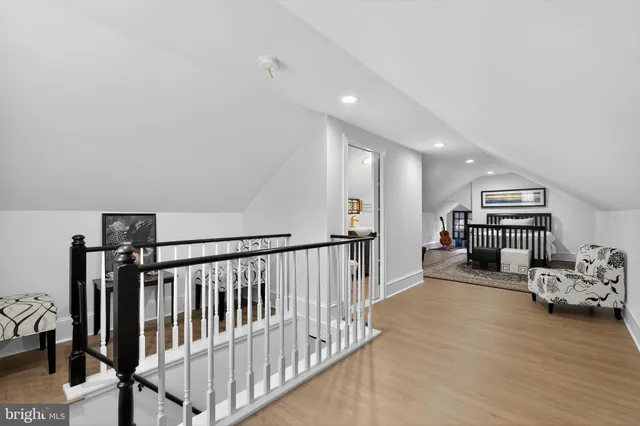 a view of a livingroom with furniture and a hallway