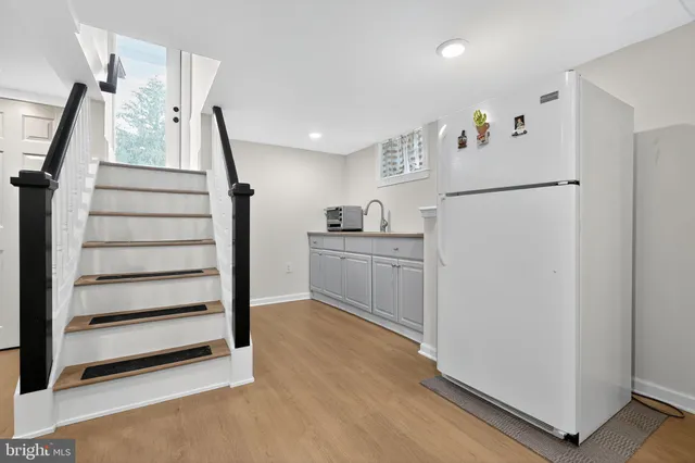 a kitchen with cabinets and white appliances