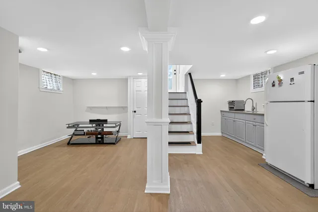 a view of kitchen with furniture and wooden floor