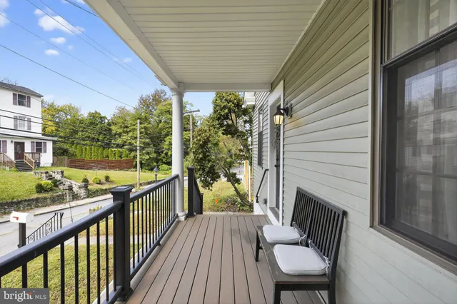 a view of a balcony with chairs