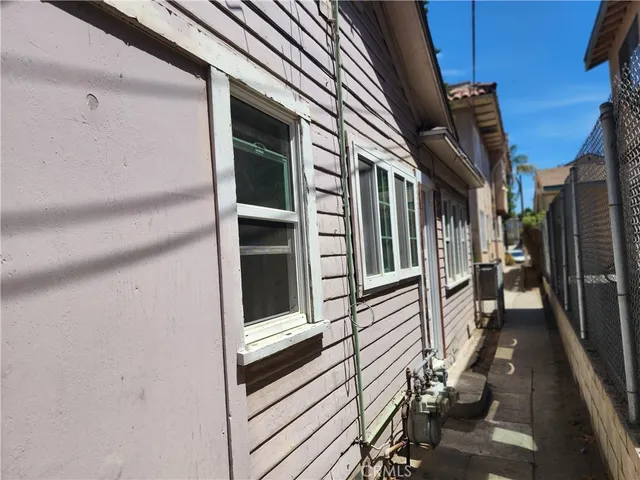 a view of a balcony with wooden floor and furniture