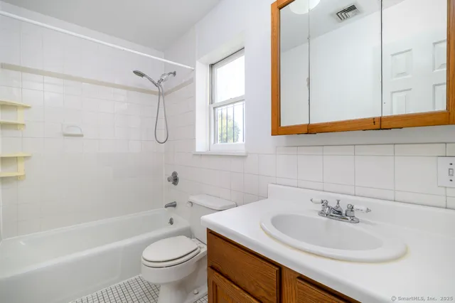 a bathroom with a sink a toilet and a bathtub
