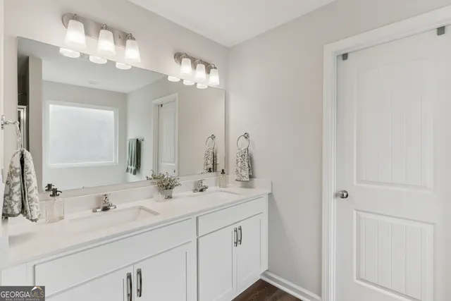 a bathroom with a bathtub and a window