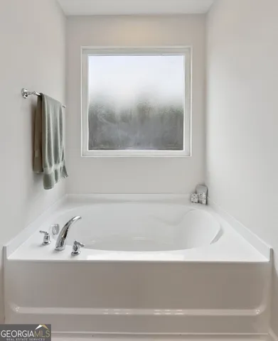 a bathroom with a glass shower door